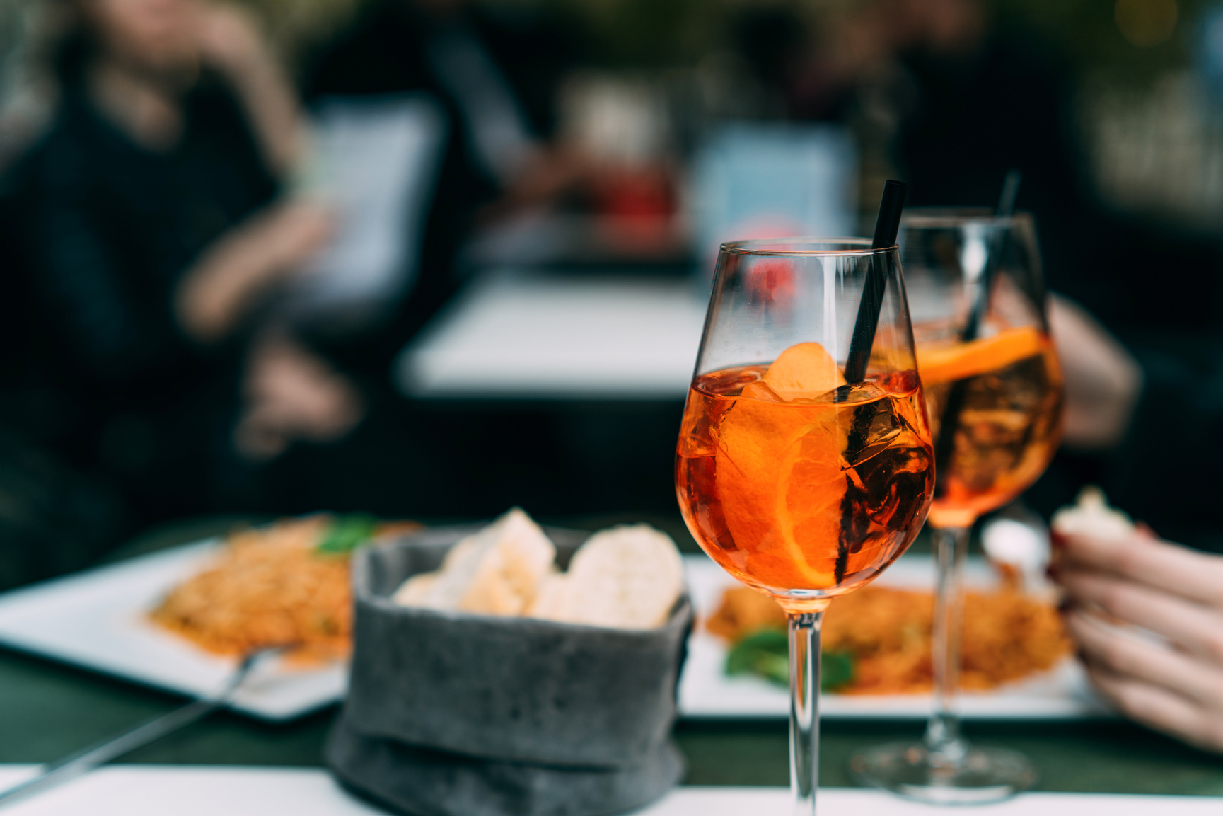 Aperol spritz cocktails on branch table